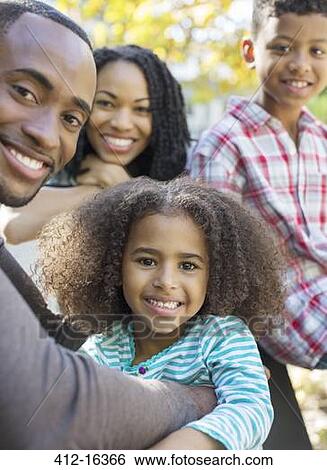 Close up portrait of smiling family View Large Photo Image Stock Photograph - Close up portrait of smiling family. Fotosearch