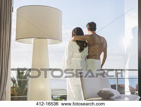 Couple hugging on balcony View Large Photo Image Stock Photograph - Couple hugging on balcony. Fotosearch