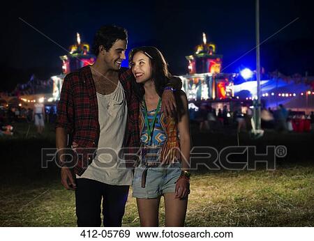 Couple leaving music festival View Large Photo Image Stock Photo - Couple leaving music festival. Fotosearch