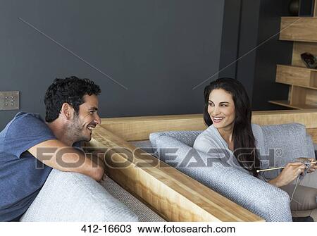 Couple talking in living room View Large Photo Image Stock Image - Couple talking in living room. Fotosearch