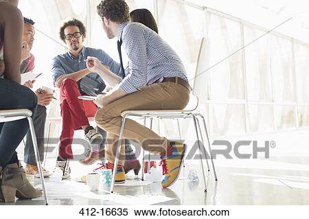Creative business people meeting in circle of chairs View Large Photo Image Stock Photography - Creative business people meeting in circle of chairs. Fotosearch