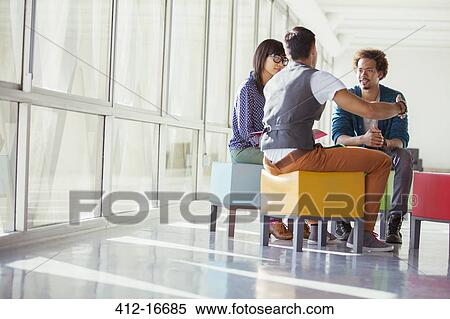 Creative business people meeting on vibrant stools View Large Photo Image Stock Photography - Creative business people meeting on vibrant stools. Fotosearch