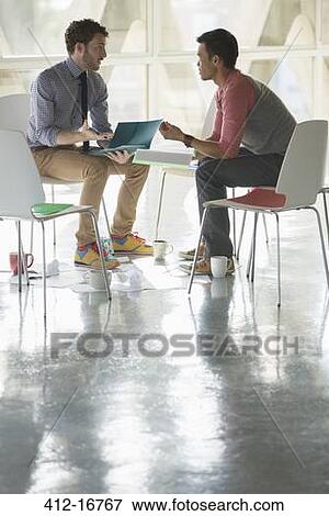 Creative businessmen meeting in circle of chairs View Large Photo Image Stock Photo - Creative businessmen meeting in circle of chairs. Fotosearch