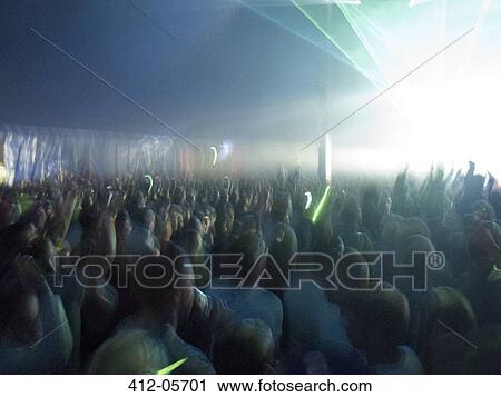 Crowd facing illuminated stage View Large Photo Image Stock Image - Crowd facing illuminated stage. Fotosearch