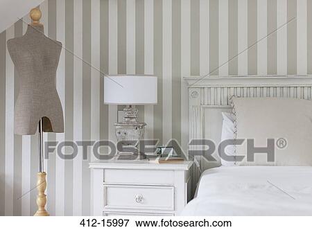 Dressmakers model and bed in feminine bedroom View Large Photo Image Stock Photo - Dressmakers model and bed in feminine bedroom. Fotosearch