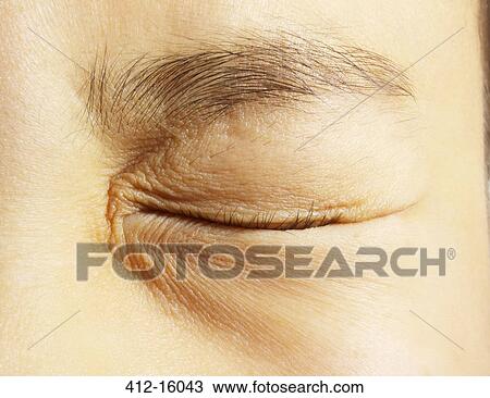 Extreme close up of girl squinting eye closed View Large Photo Image Stock Image - Extreme close up of girl squinting eye closed. Fotosearch