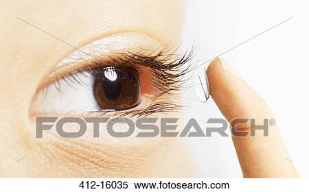 Extreme close up of woman putting contact lens in eye View Large Photo Image Stock Photography - Extreme close up of woman putting contact lens in eye. Fotosearch