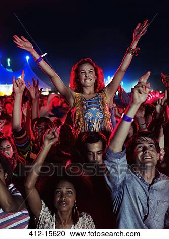 Fans cheering at music festival View Large Photo Image Stock Image - Fans cheering at music festival. Fotosearch