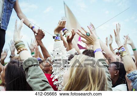 Fans reaching to shake hands with performer at music festival View Large Photo Image Stock Photography - Fans reaching to shake hands with performer at music festival. Fotosearch