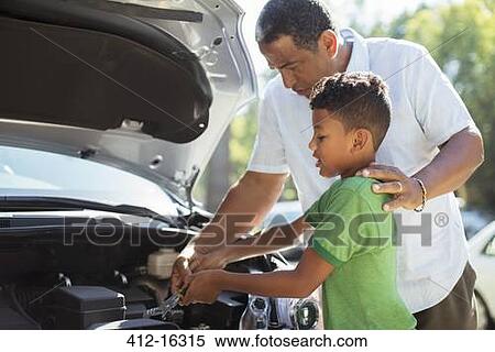 Grandfather and grandson repairing car engine View Large Photo Image Stock Photography - Grandfather and grandson repairing car engine. Fotosearch