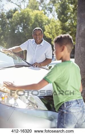 Grandfather and grandson washing car View Large Photo Image Stock Image - Grandfather and grandson washing car. Fotosearch