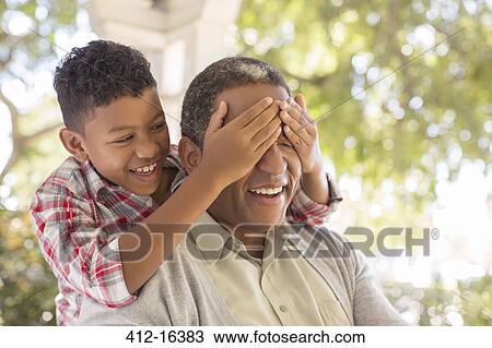 Grandson surprising grandfather on porch View Large Photo Image Stock Image - Grandson surprising grandfather on porch. Fotosearch