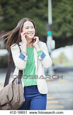 Happy businesswoman talking on cell phone in crosswalk View Large Photo Image Stock Image - Happy businesswoman talking on cell phone in crosswalk. Fotosearch