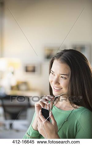 Happy businesswoman using hands-free device with cell phone View Large Photo Image Stock Photography - Happy businesswoman using hands-free device with cell phone. Fotosearch