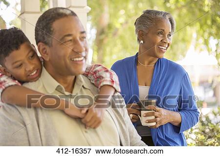 Happy grandparents and grandson on porch View Large Photo Image Stock Photo - Happy grandparents and grandson on porch. Fotosearch