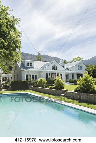 Luxury house and swimming pool View Large Photo Image Stock Photo - Luxury house and swimming pool. Fotosearch