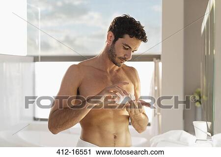 Man taking medication in bathroom View Large Photo Image Stock Image - Man taking medication in bathroom. Fotosearch