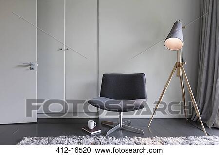 Modern chair and lamp View Large Photo Image Stock Image - Modern chair and lamp. Fotosearch