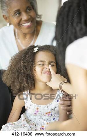Mother playfully touching daughter's nose View Large Photo Image Stock Photo - Mother playfully touching daughter's nose. Fotosearch