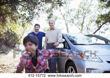 Multi-generation men outside car View Large Photo Image Stock Image - Multi-generation men outside car. Fotosearch