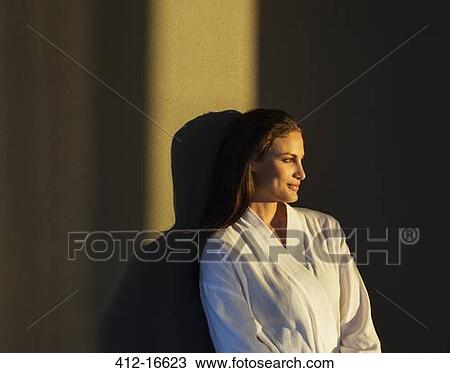 Pensive woman in bathrobe View Large Photo Image Stock Image - Pensive woman in bathrobe. Fotosearch