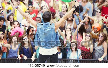 Performer facing cheering crowd View Large Photo Image Stock Photo - Performer facing cheering crowd. Fotosearch