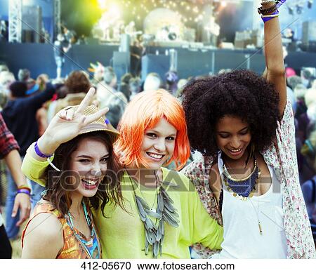 Portrait of cheering friends at music festival View Large Photo Image Stock Image - Portrait of cheering friends at music festival. Fotosearch