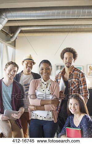 Portrait of confident casual business people in office View Large Photo Image Stock Photography - Portrait of confident casual business people in office. Fotosearch