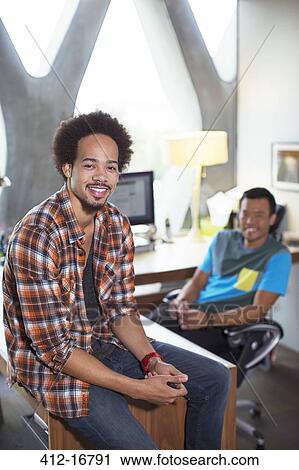 Portrait of confident casual businessmen in office View Large Photo Image Stock Image - Portrait of confident casual businessmen in office. Fotosearch