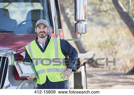 Portrait of confident roadside mechanic leaning on truck View Large Photo Image Stock Photo - Portrait of confident roadside mechanic leaning on truck. Fotosearch