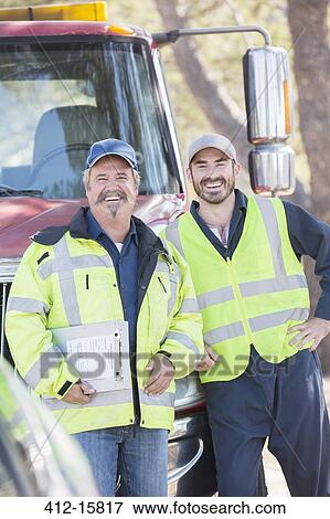 Portrait of confident roadside mechanics View Large Photo Image Stock Photo - Portrait of confident roadside mechanics. Fotosearch