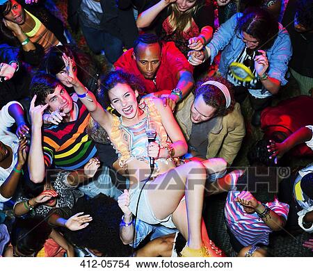 Portrait of enthusiastic performer crowd surfing at music festival View Large Photo Image Picture - Portrait of enthusiastic performer crowd surfing at music festival. Fotosearch