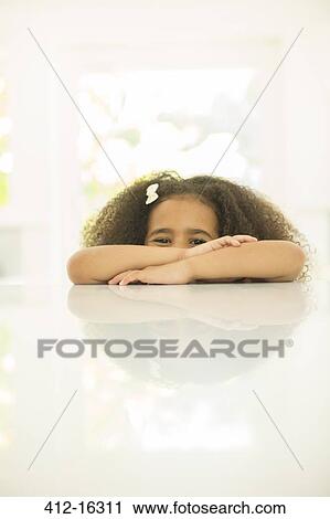 Portrait of girl leaning on table View Large Photo Image Stock Image - Portrait of girl leaning on table. Fotosearch