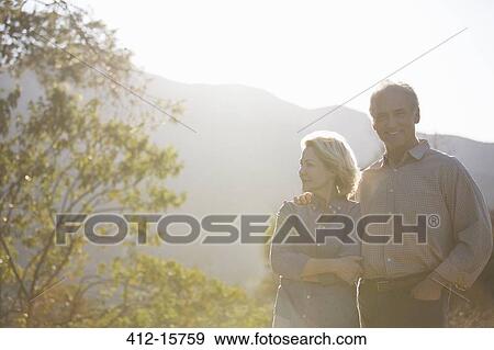 Stock Photo - Portrait of happy senior couple outdoors. Fotosearch