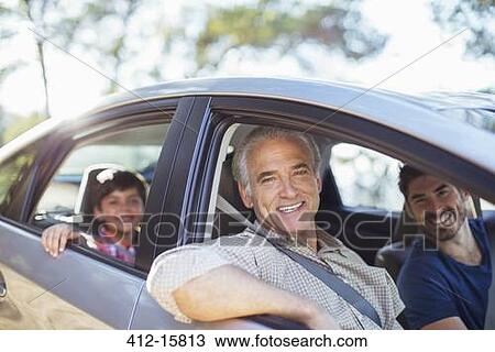 Stock Image - Portrait of multi-generation men inside car. Fotosearch