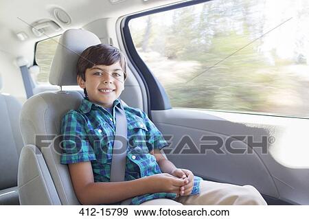 Portrait of smiling boy inside car View Large Photo Image Stock Photo - Portrait of smiling boy inside car. Fotosearch
