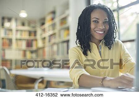 Portrait of smiling businesswoman at laptop View Large Photo Image Stock Image - Portrait of smiling businesswoman at laptop. Fotosearch
