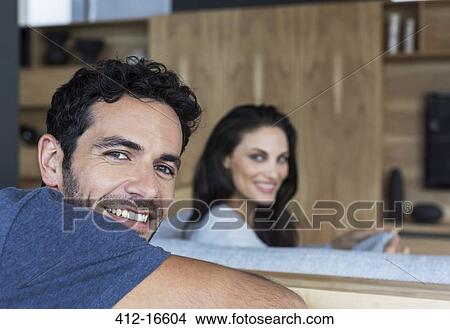 Picture - Portrait of smiling couple in living room. Fotosearch