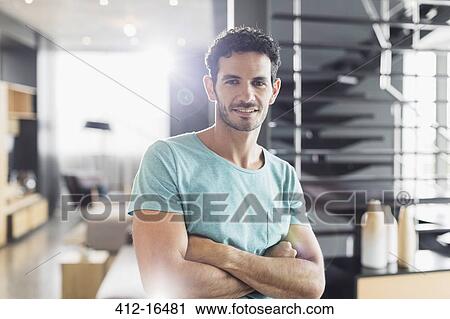 Portrait of smiling man with arms crossed View Large Photo Image Stock Image - Portrait of smiling man with arms crossed. Fotosearch