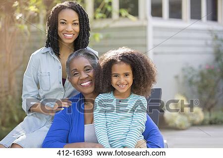 Portrait of smiling multi-generation women on patio View Large Photo Image Stock Image - Portrait of smiling multi-generation women on patio. Fotosearch