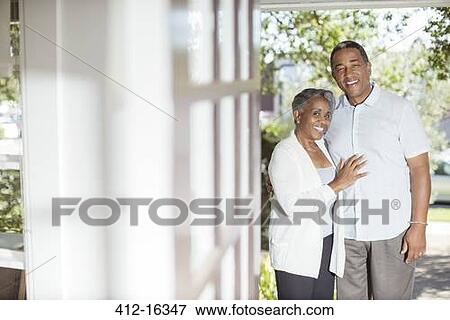 Portrait of smiling senior couple in doorway View Large Photo Image Stock Photo - Portrait of smiling senior couple in doorway. Fotosearch