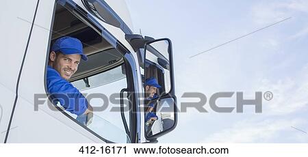 Portrait of smiling truck driver leaning out window View Large Photo Image Stock Image - Portrait of smiling truck driver leaning out window. Fotosearch