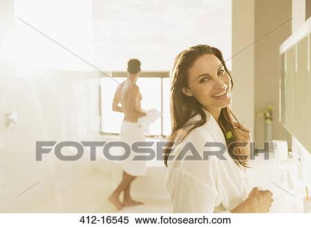 Portrait of smiling woman in bathroom View Large Photo Image Stock Photography - Portrait of smiling woman in bathroom. Fotosearch