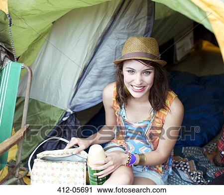 Portrait of smiling woman in tent at music festival View Large Photo Image Stock Image - Portrait of smiling woman in tent at music festival. Fotosearch