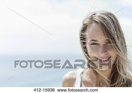 Stock Photograph - Portrait of smiling woman. Fotosearch
