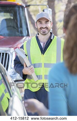 Roadside mechanic arriving to help woman View Large Photo Image Stock Image - Roadside mechanic arriving to help woman. Fotosearch