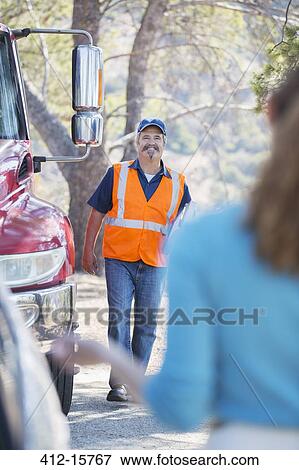 Roadside mechanic arriving to help woman View Large Photo Image Stock Photo - Roadside mechanic arriving to help woman. Fotosearch