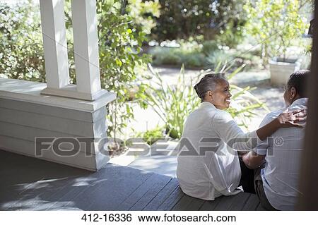 Senior couple hugging on porch View Large Photo Image Stock Photograph - Senior couple hugging on porch. Fotosearch