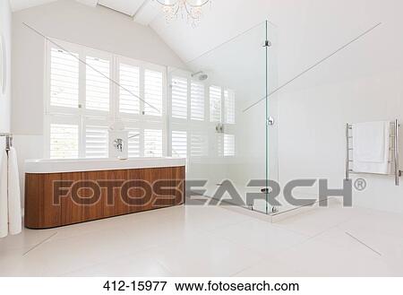 Stock Photo - Soaking tub and shower in modern bathroom. Fotosearch