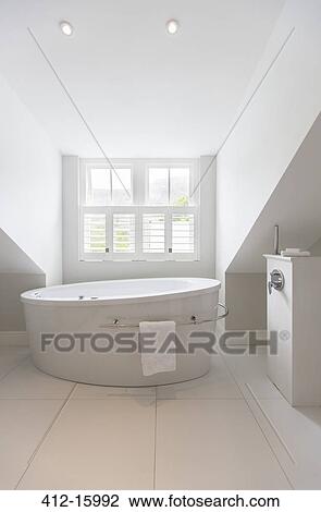 Soaking tub in modern bathroom View Large Photo Image Stock Image - Soaking tub in modern bathroom. Fotosearch